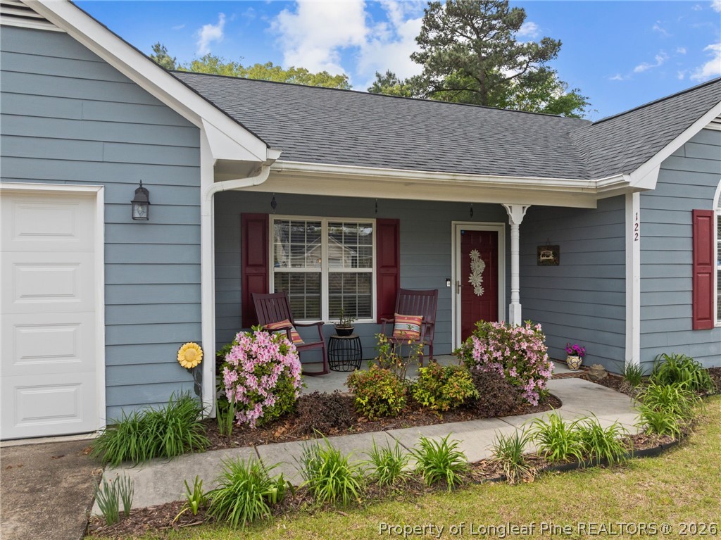 122 Raymond Street Raeford, NC 28376 - Photo 5 of 36 a front view of a house with garden