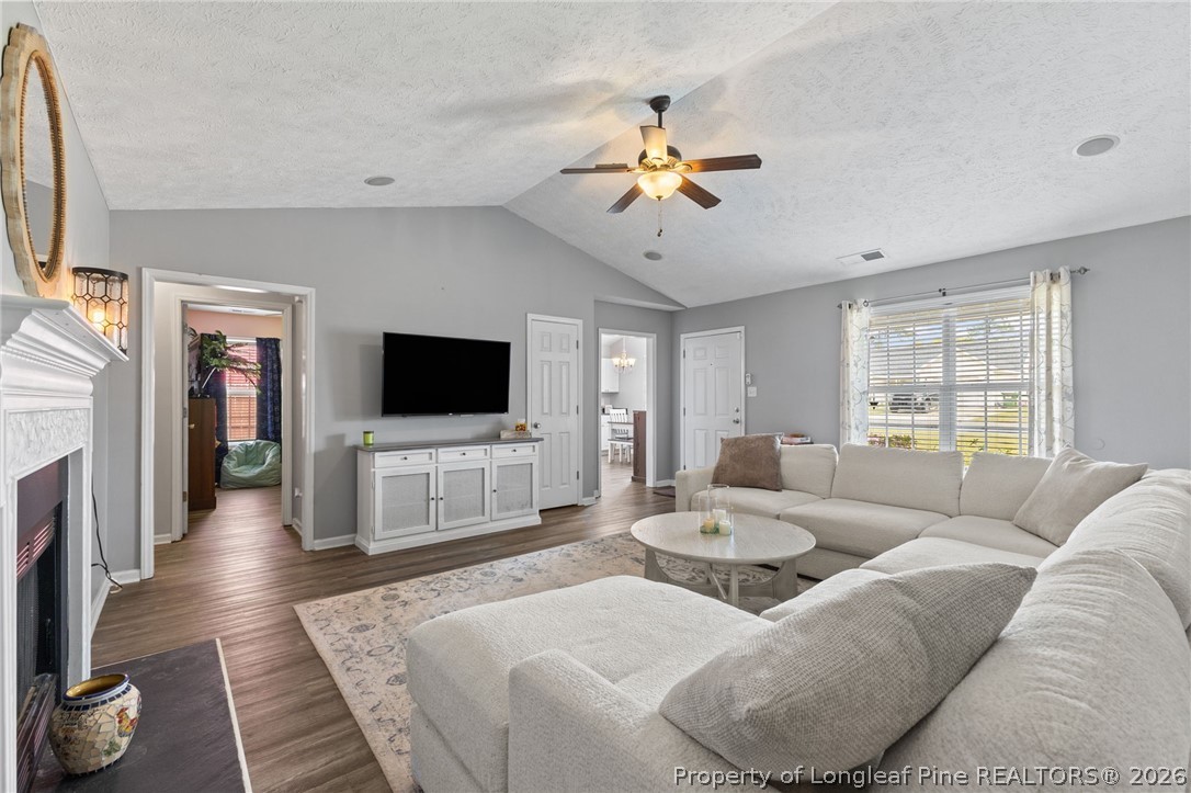 122 Raymond Street Raeford, NC 28376 - Photo 10 of 36 a living room with furniture and a flat screen tv