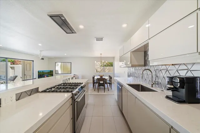 a kitchen with counter top space and appliances