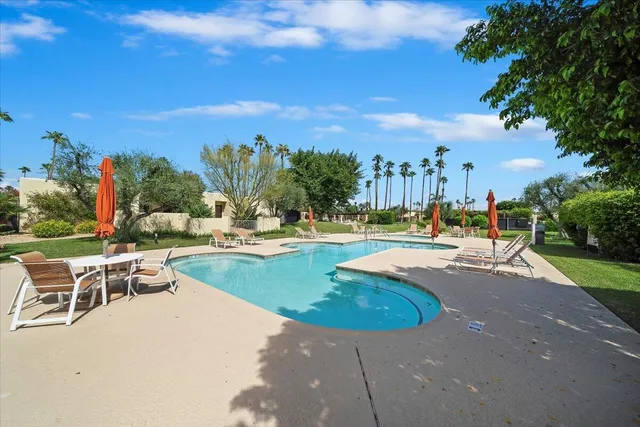 a view of a swimming pool with a patio
