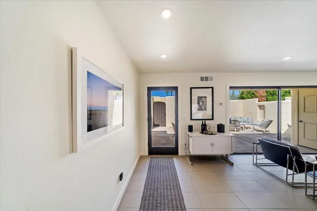 a living room with furniture and natural light