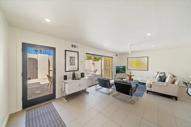 a living room with furniture and a window