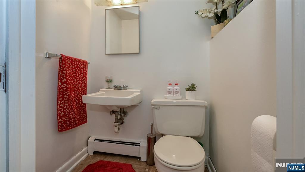 277 French Hill Road Wayne, NJ 07470 - Photo 14 of 28 a bathroom with a sink a toilet and mirror