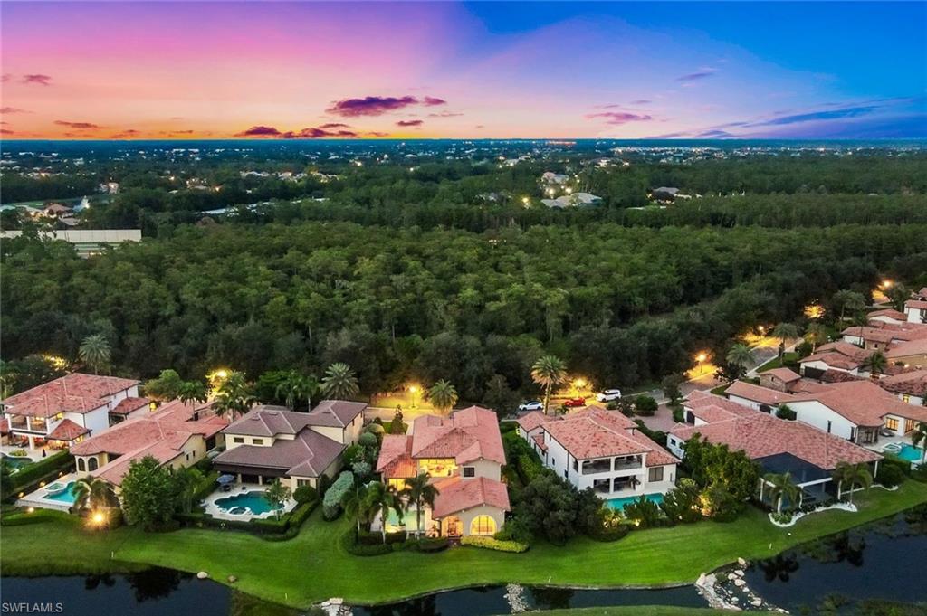 16699 Pistoia Way Naples, FL 34110 - Photo 43 of 48 a view of a town with swimming pool and mountain view