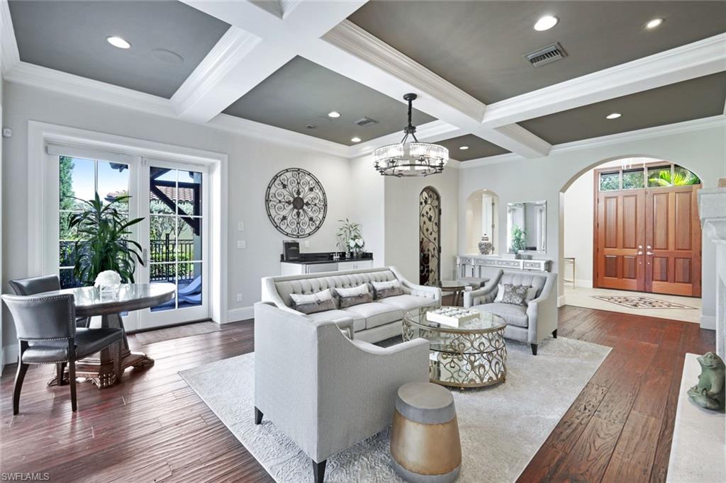 16699 Pistoia Way Naples, FL 34110 - Photo 8 of 48 a living room with furniture and a large window