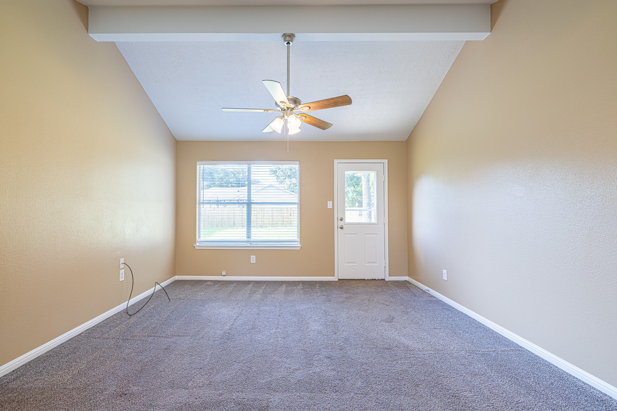 16381 Many Trees Lane Conroe, TX 77302 - Photo 10 of 24 Living Room with vaulted ceiling