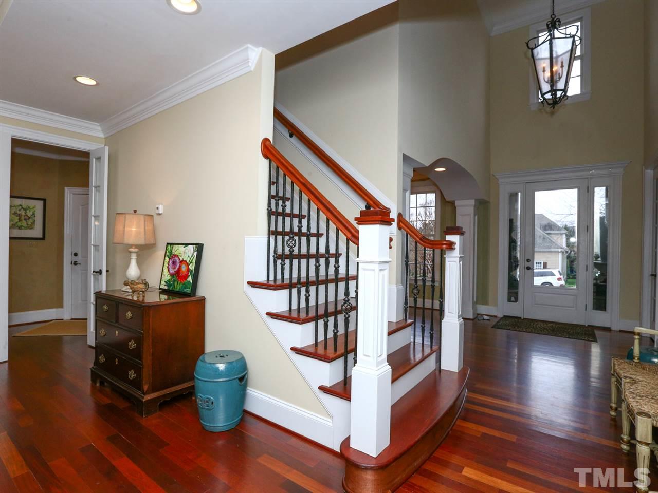 1824 Stannard Trail Raleigh, NC 27612 - Photo 3 of 25 Breathtaking two story entrance way with Custom Brazilian Cherry hardwood floors.