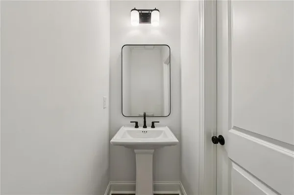 a bathroom with a sink and mirror
