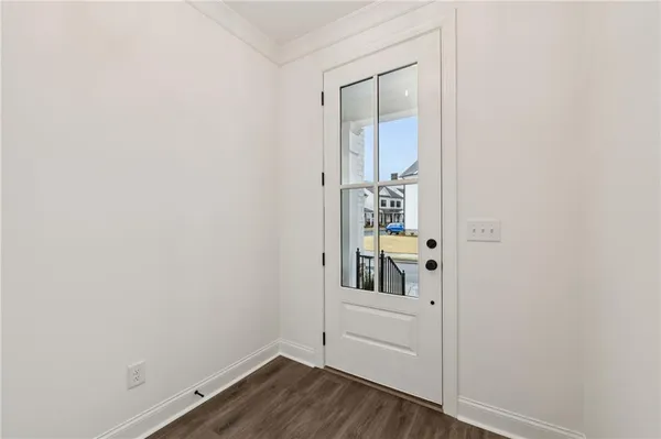 a view of front door with wooden floor