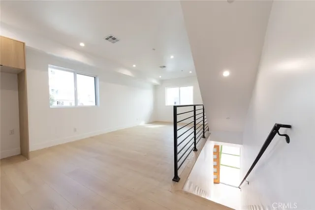 a view of a hallway with windows
