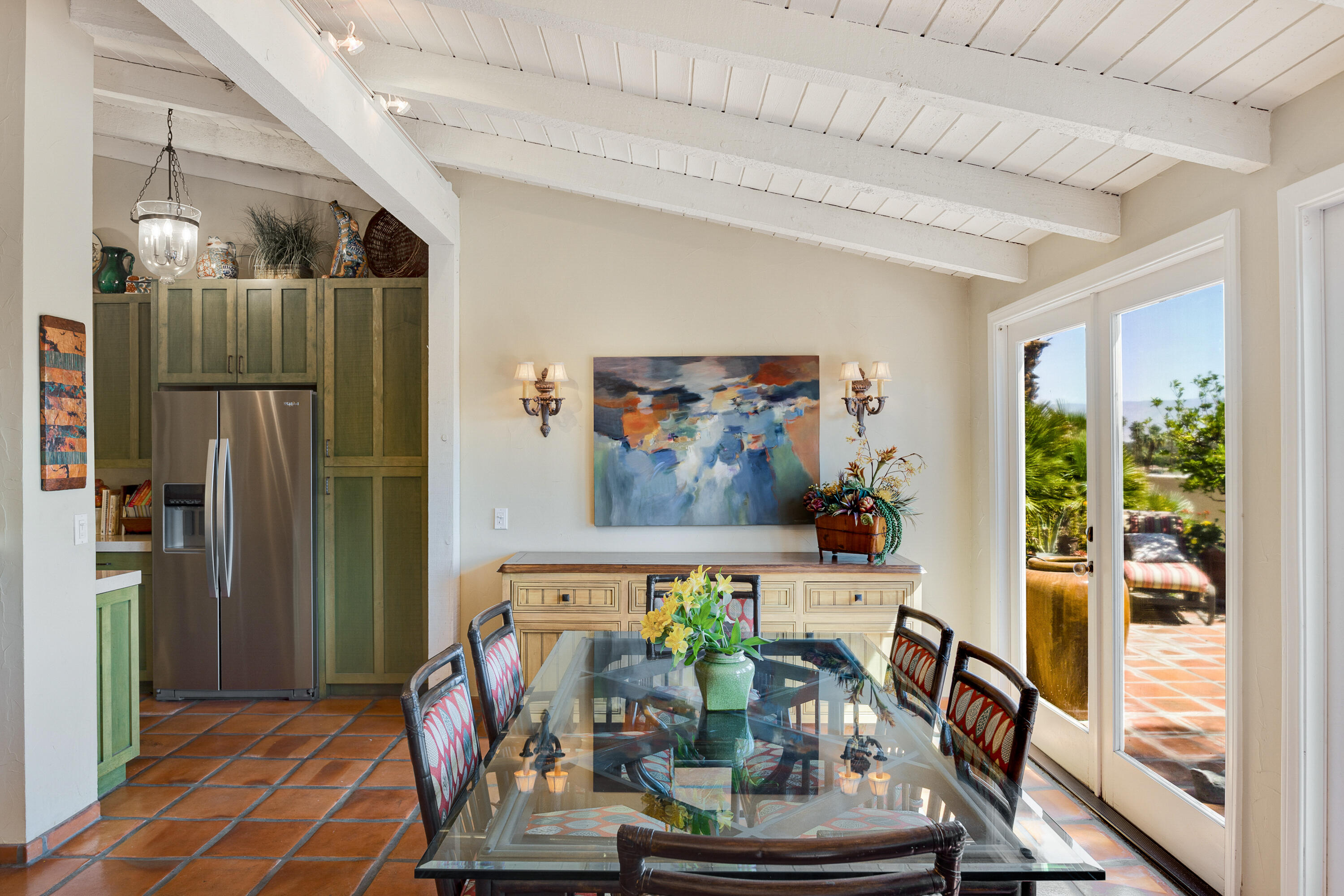 40162 Vía Del Oro Rancho Mirage, CA 92270 - Photo 11 of 34 a view of a dining room with furniture wooden floor and a chandelier