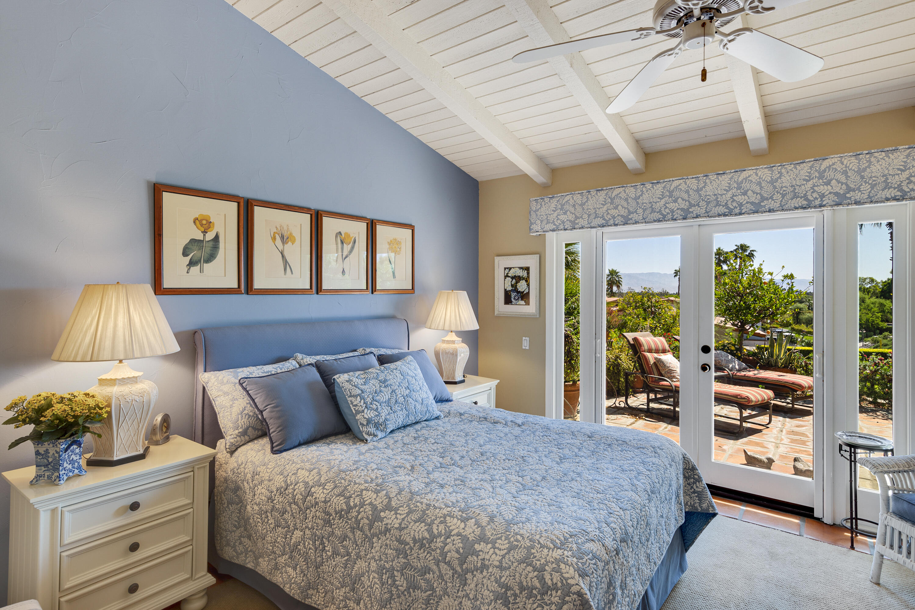 40162 Vía Del Oro Rancho Mirage, CA 92270 - Photo 17 of 34 a bedroom with a bed and large windows