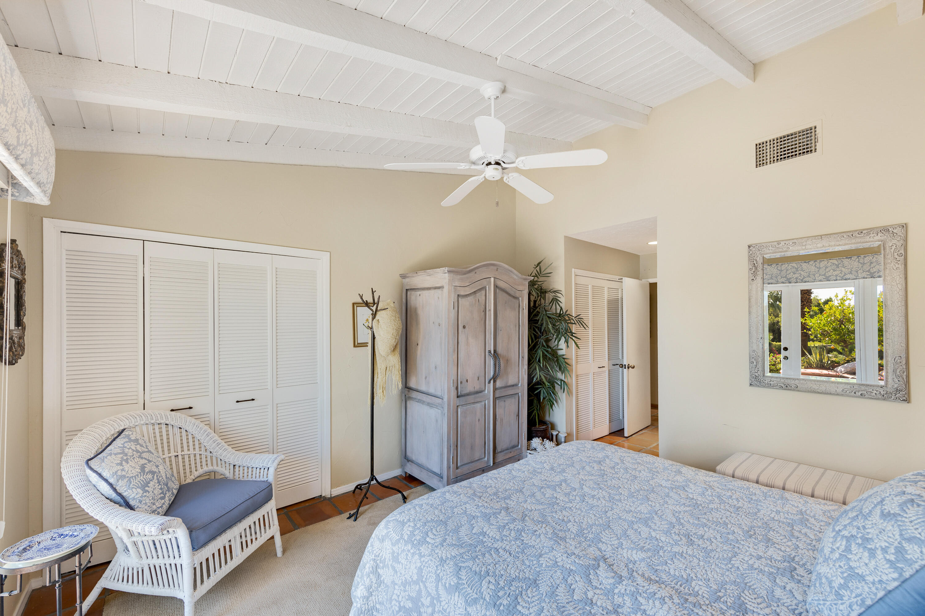 40162 Vía Del Oro Rancho Mirage, CA 92270 - Photo 18 of 34 a bedroom with a bed couch and window
