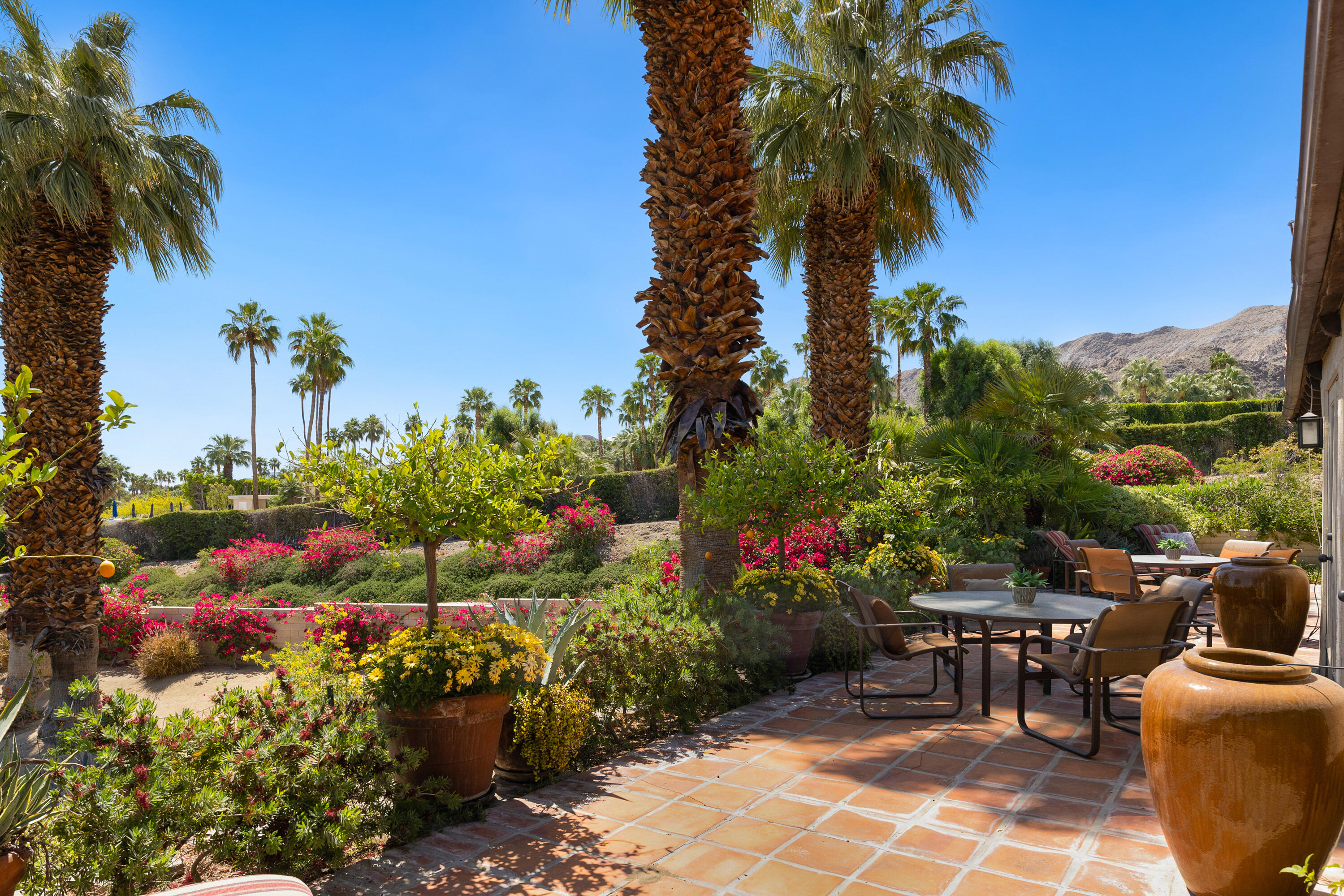 40162 Vía Del Oro Rancho Mirage, CA 92270 - Photo 28 of 34 a view of a table and chairs in a backyard