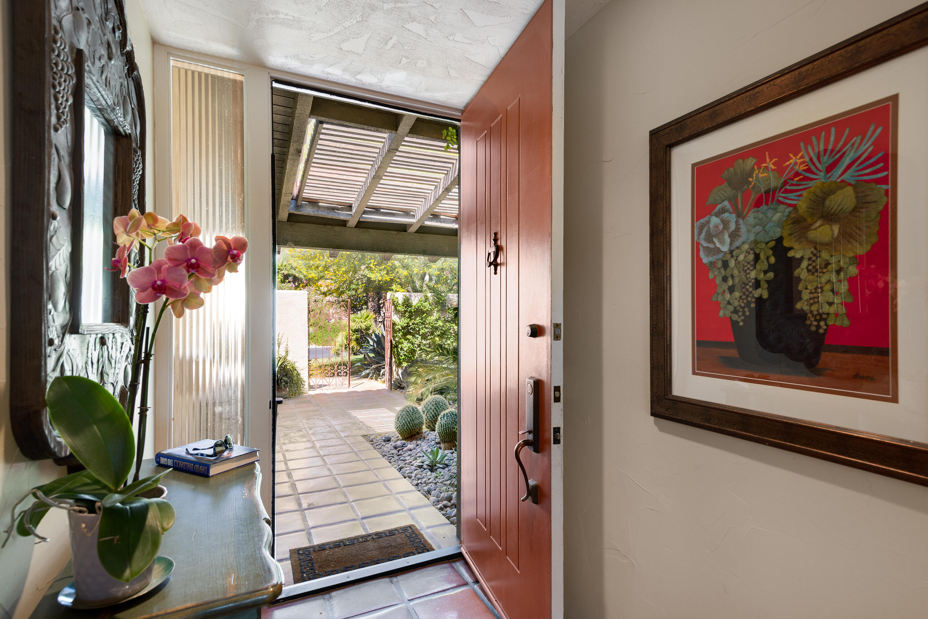 40162 Vía Del Oro Rancho Mirage, CA 92270 - Photo 5 of 34 a view of a hallway with furniture and a potted plant