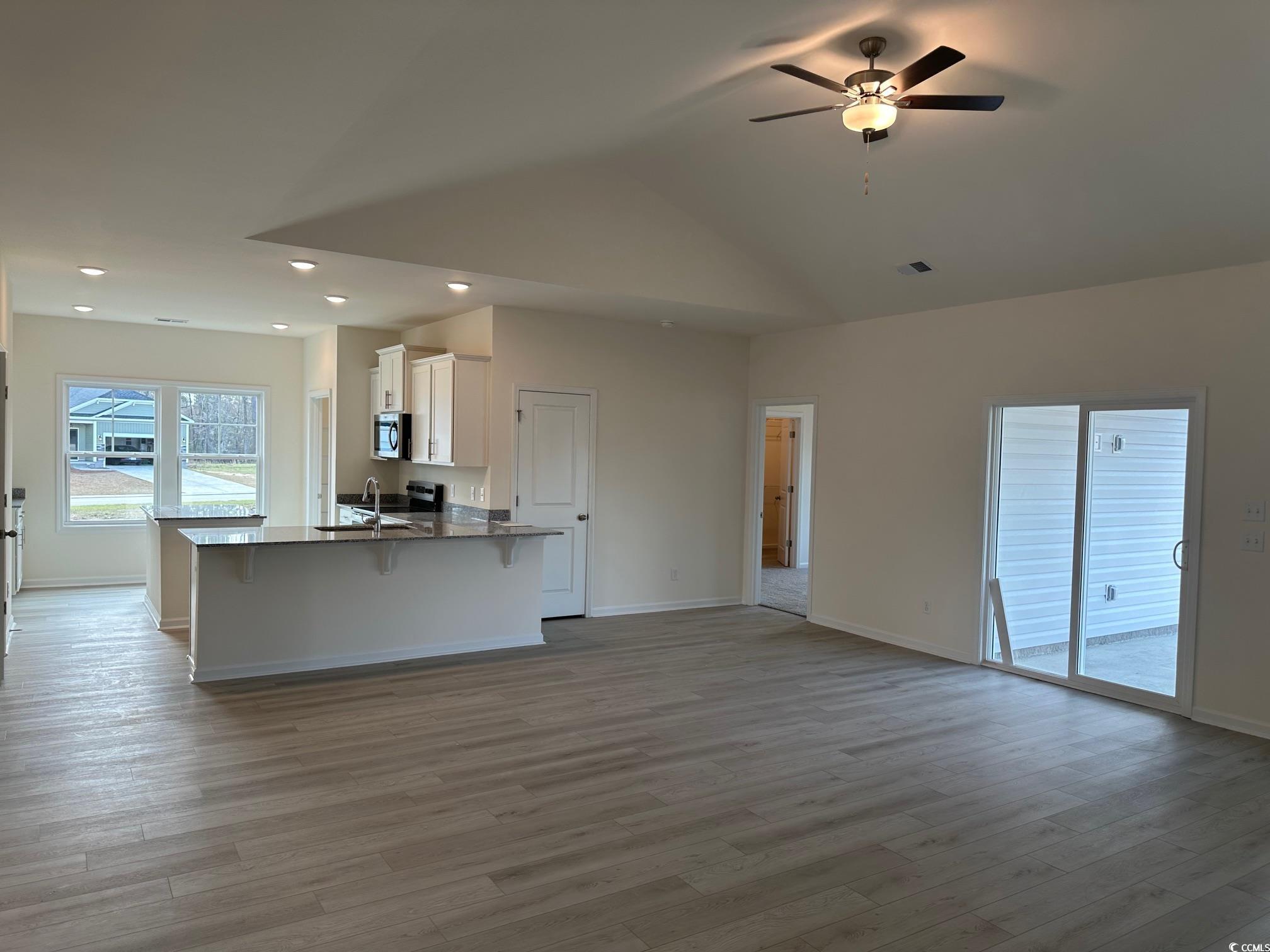 537 Honeyhill Loop Conway, SC 29526 - Photo 5 of 40 Kitchen with stainless steel microwave, white cabi