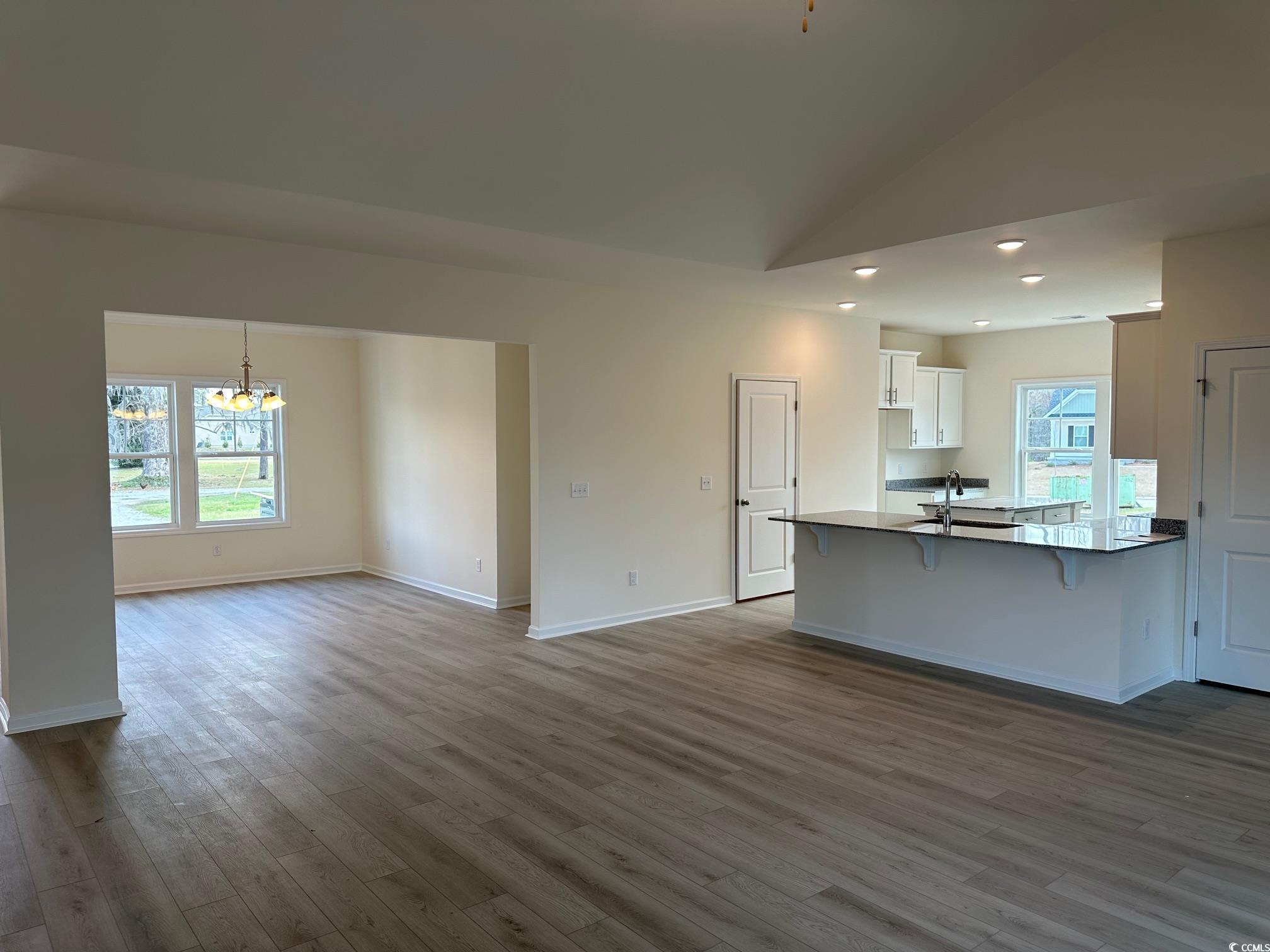 537 Honeyhill Loop Conway, SC 29526 - Photo 6 of 40 Kitchen with a notable chandelier, a breakfast bar