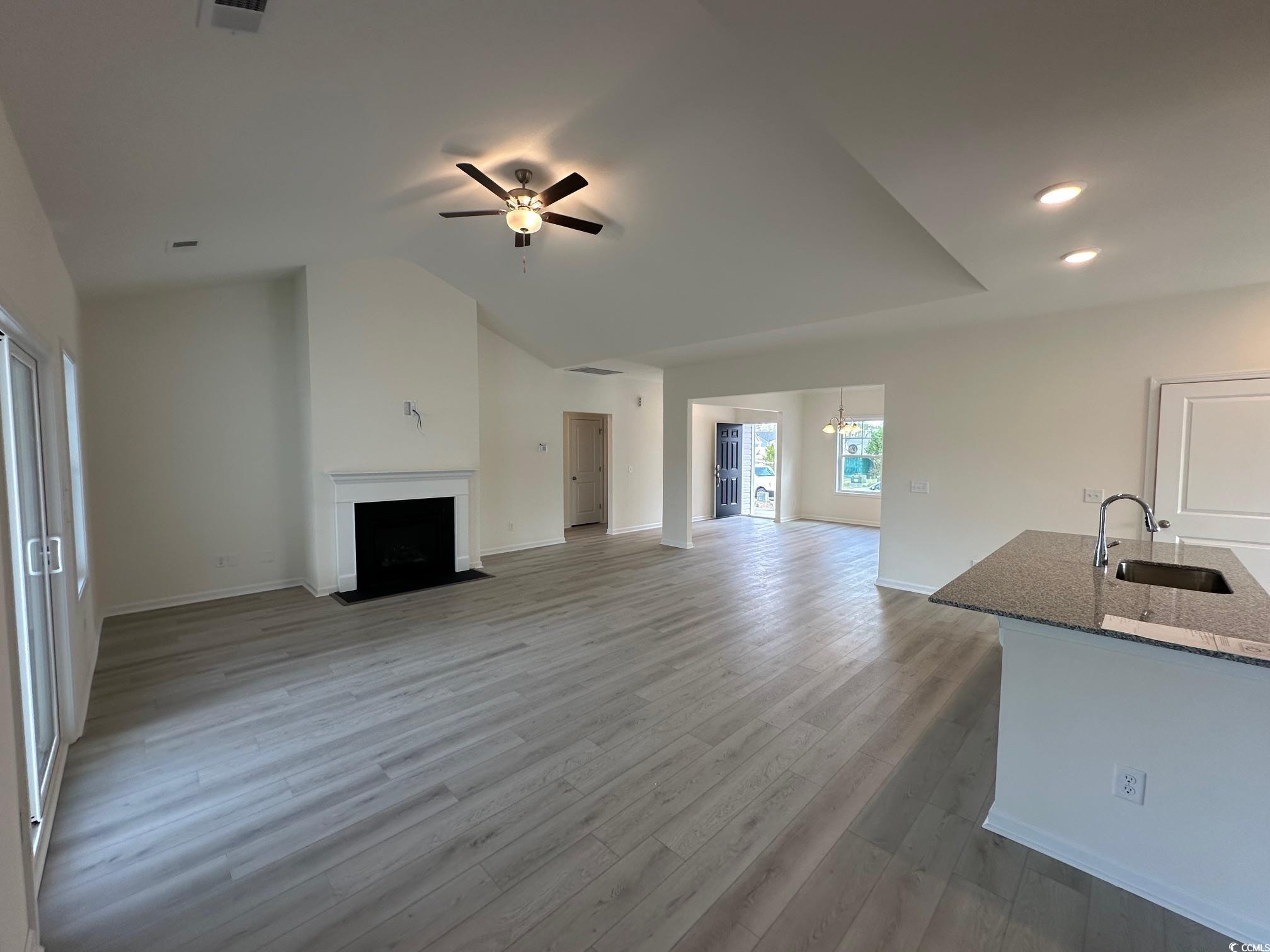 537 Honeyhill Loop Conway, SC 29526 - Photo 9 of 40 Unfurnished living room with a fireplace with flus