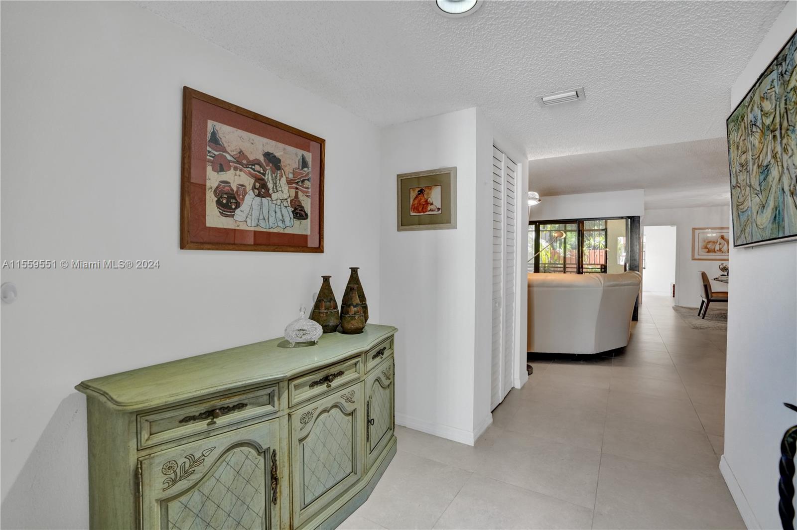 337 Ives Dairy Road, Unit 33704 Miami, FL 33179 - Photo 15 of 22 a view of a bedroom with window cabinet mirror and windows