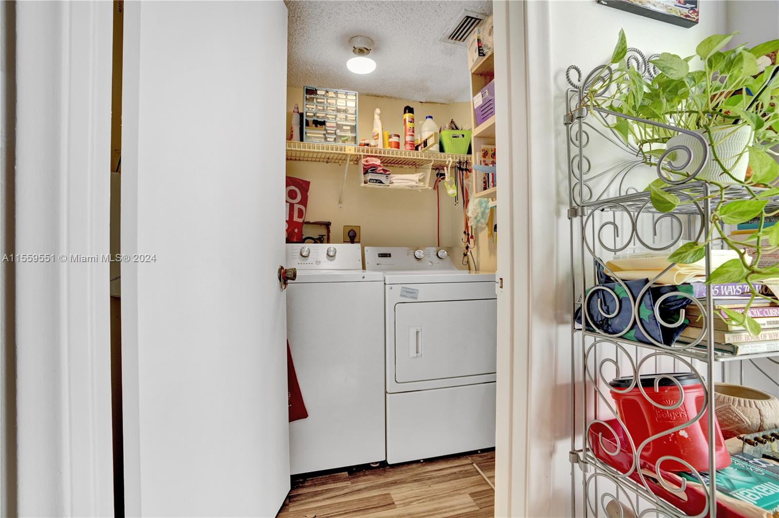 337 Ives Dairy Road, Unit 33704 Miami, FL 33179 - Photo 16 of 22 a view of walk in closet with clothes