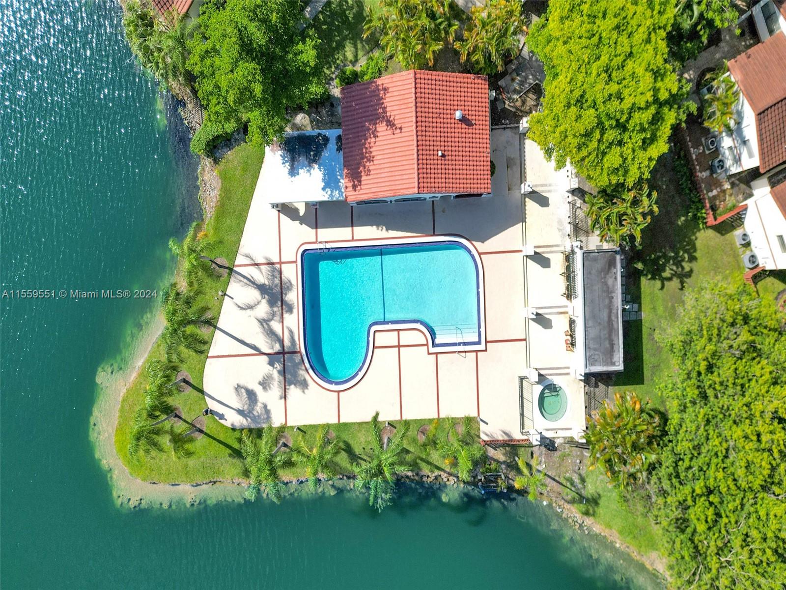 337 Ives Dairy Road, Unit 33704 Miami, FL 33179 - Photo 19 of 22 an aerial view of a house with swimming pool and garden