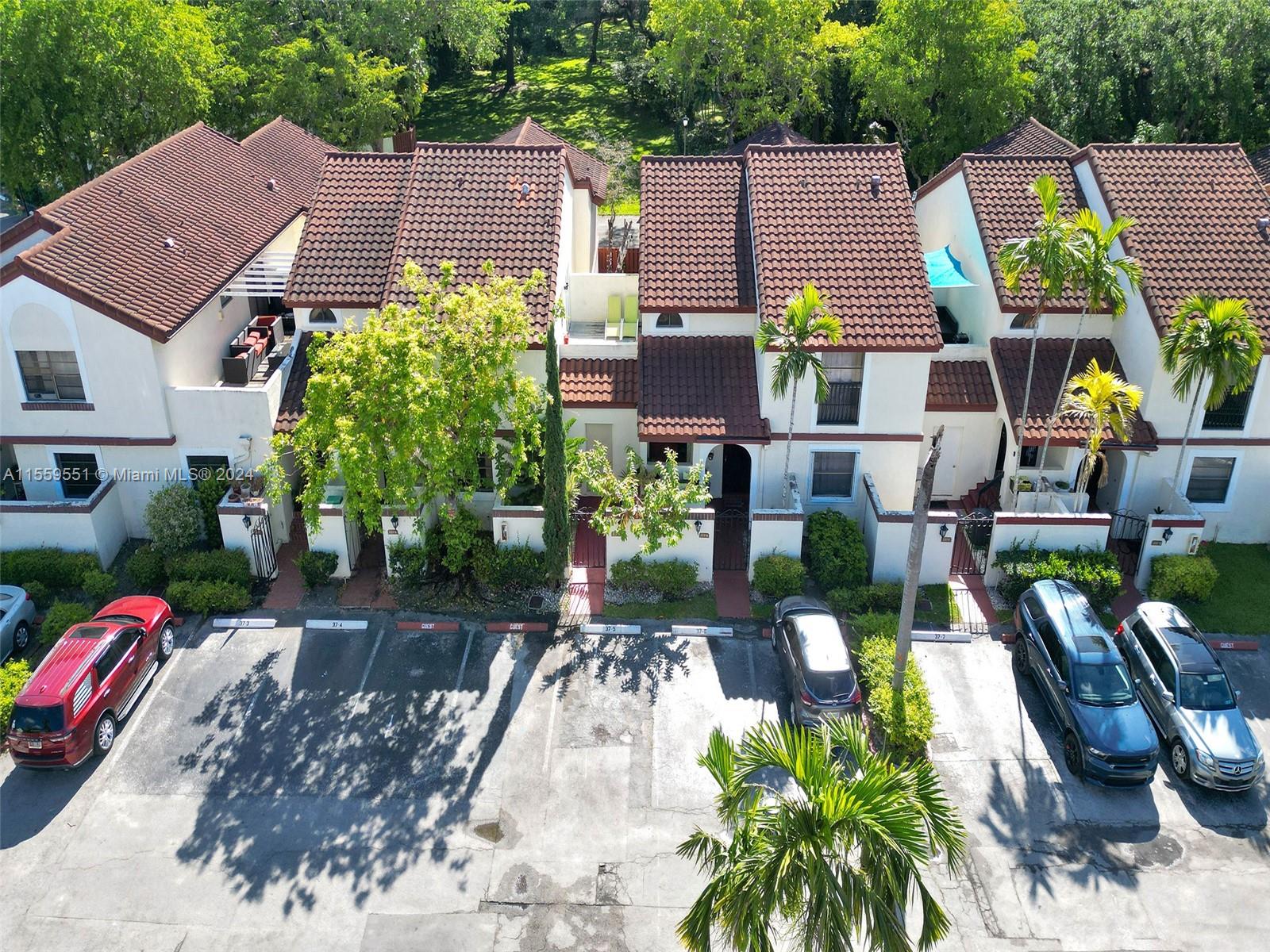 337 Ives Dairy Road, Unit 33704 Miami, FL 33179 - Photo 2 of 22 an aerial view of a house with garden space and street view