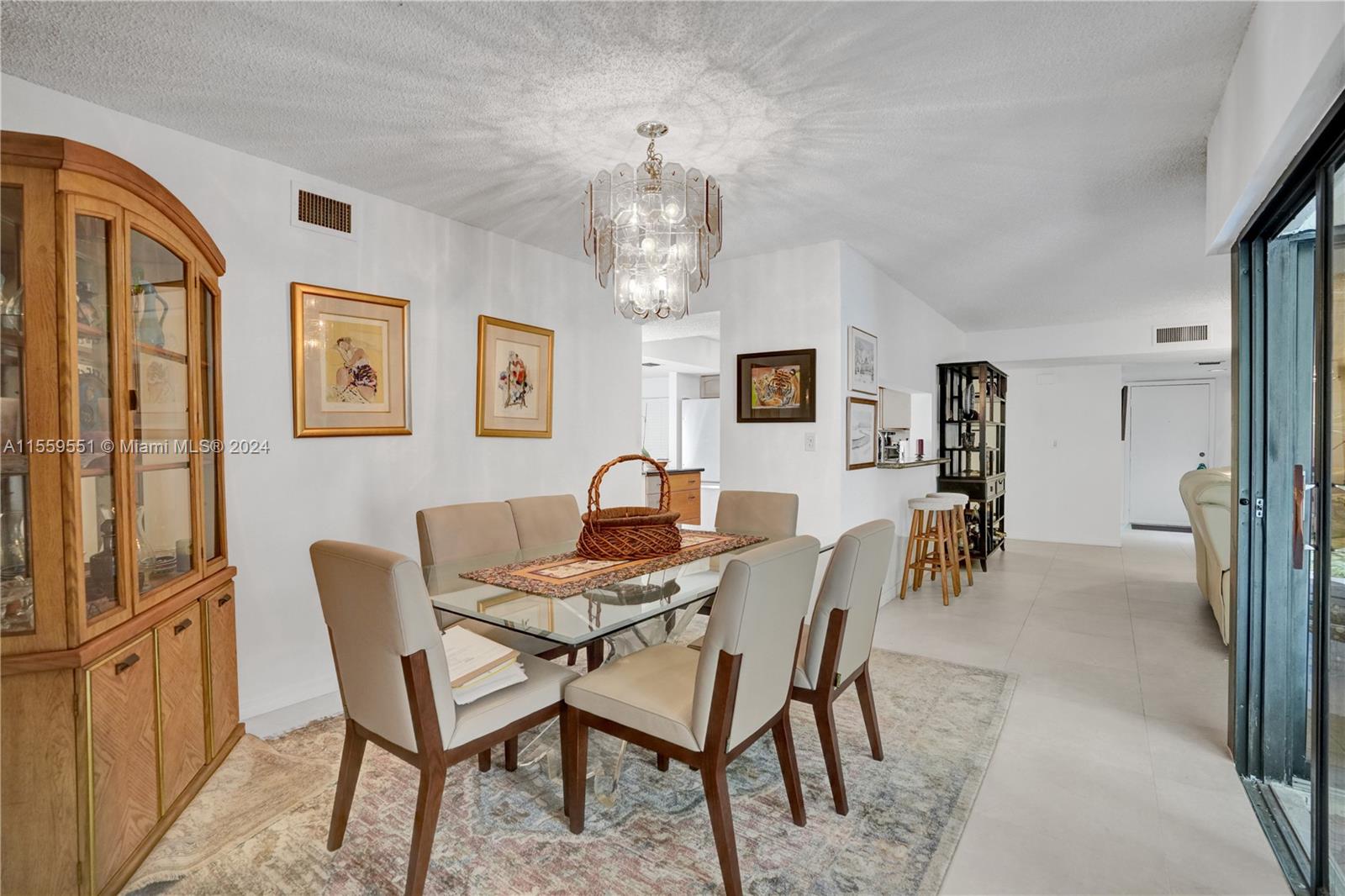 337 Ives Dairy Road, Unit 33704 Miami, FL 33179 - Photo 7 of 22 a view of a dining room with furniture