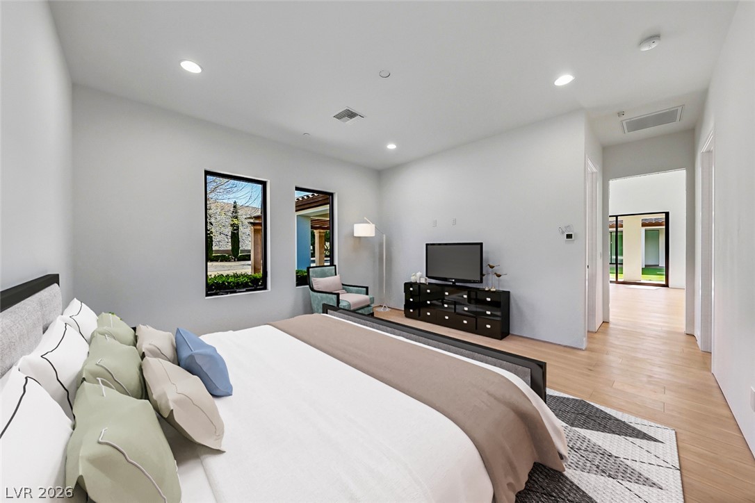 1140 Julie Road Henderson, NV 89002 - Photo 71 of 71 Natural light filters through modern windows in this inviting, spacious primary bedroom.