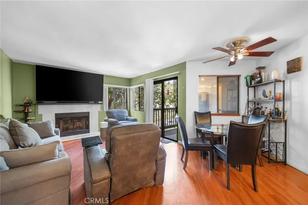 a living room with fireplace furniture and a flat screen tv