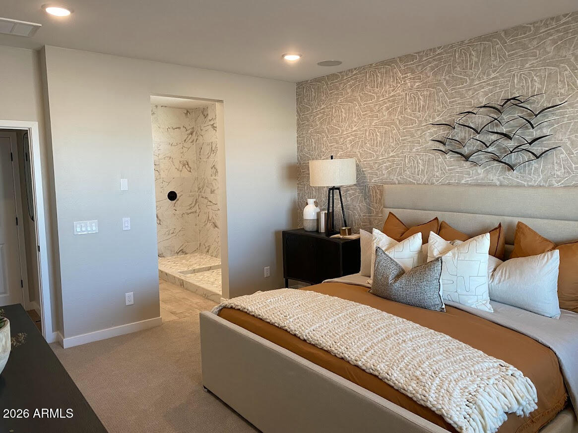 17547 West Fulton Street Goodyear, AZ 85338 - Photo 8 of 10 a bedroom with a bed and a painting on the wall