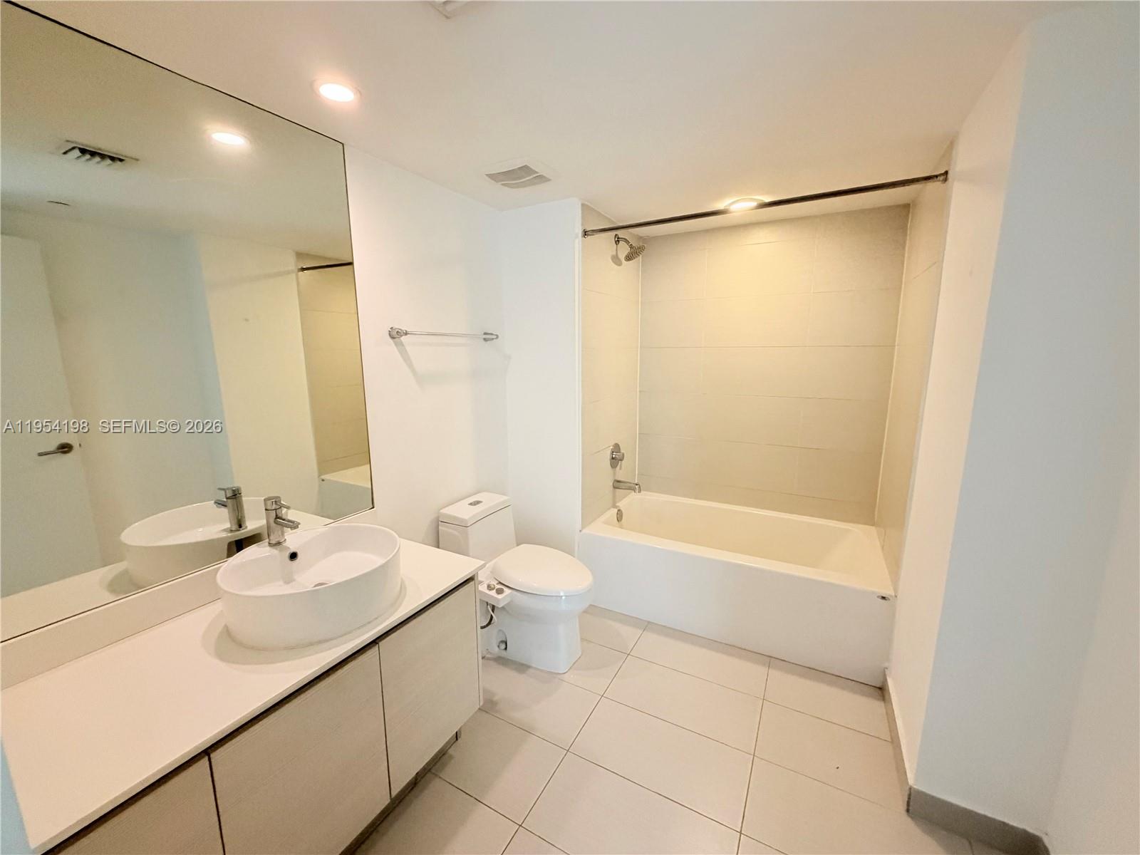 4250 Biscayne Boulevard, Unit 1014 Miami, FL 33137 - Photo 12 of 63 a bathroom with a sink toilet and shower