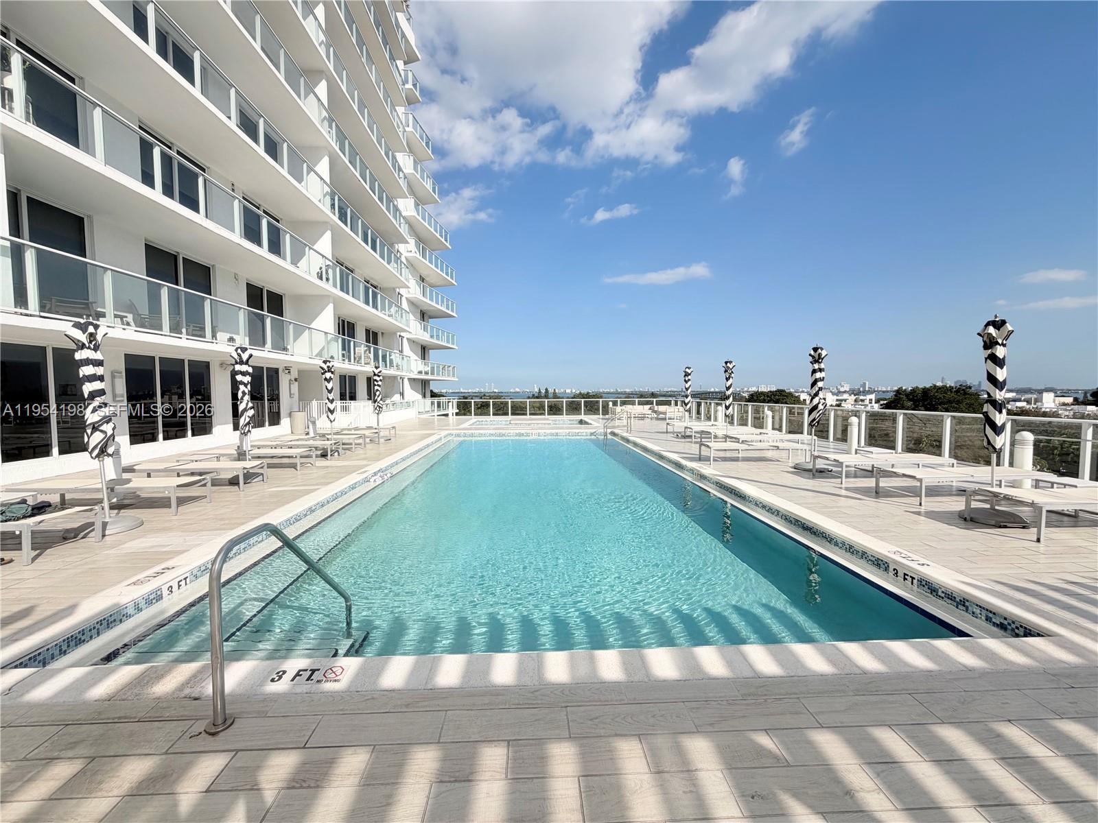 4250 Biscayne Boulevard, Unit 1014 Miami, FL 33137 - Photo 30 of 63 a view of a patio with a yard