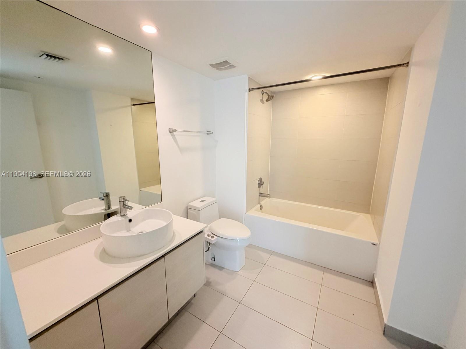 4250 Biscayne Boulevard, Unit 1014 Miami, FL 33137 - Photo 41 of 63 a bathroom with a sink toilet and shower