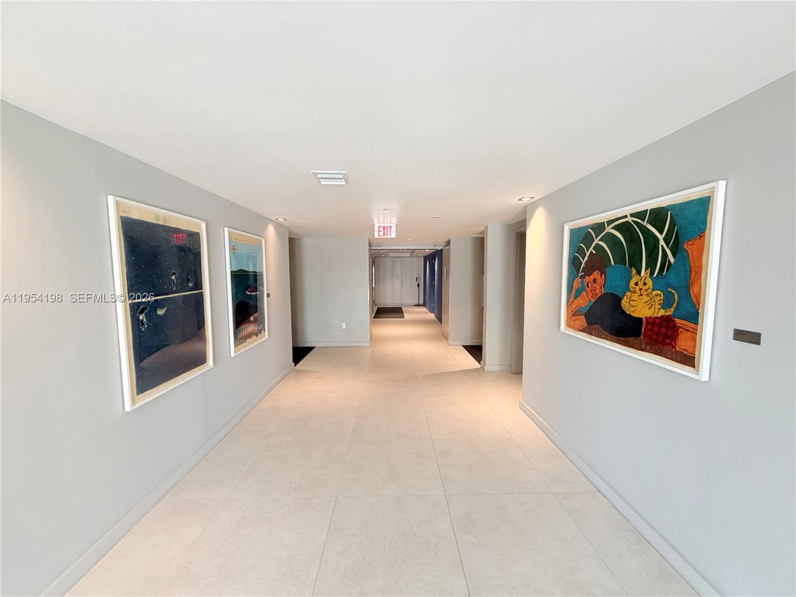 4250 Biscayne Boulevard, Unit 1014 Miami, FL 33137 - Photo 42 of 63 a view of a hallway with a painting on the wall