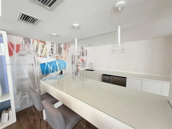 a view of a terrace with seating area and barbeque oven