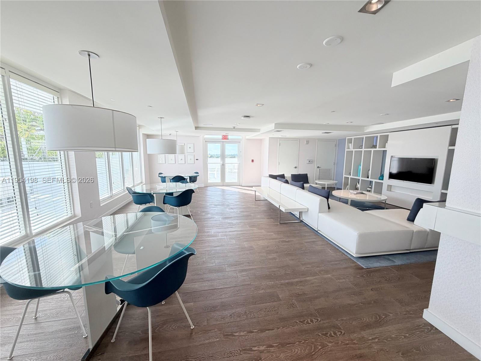 4250 Biscayne Boulevard, Unit 1014 Miami, FL 33137 - Photo 47 of 63 a living room with furniture and a flat screen tv