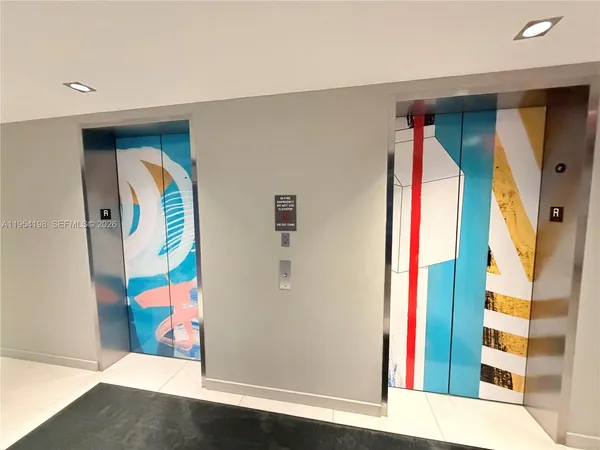 a view of living room filled with furniture and white walls