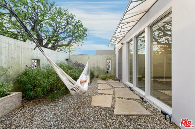 a bathroom with a sink a mirror and a bathtub