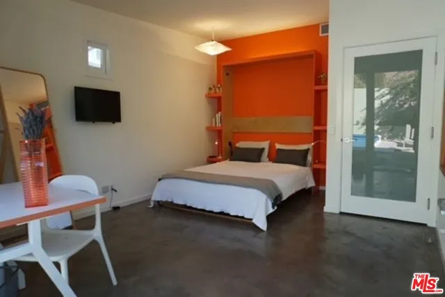 a view of livingroom with furniture and a window