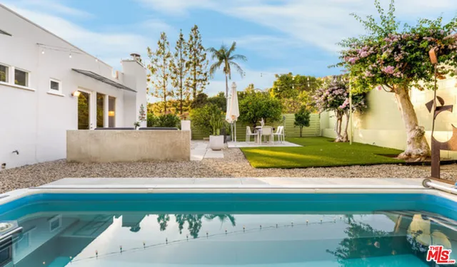 a view of a patio with swimming pool