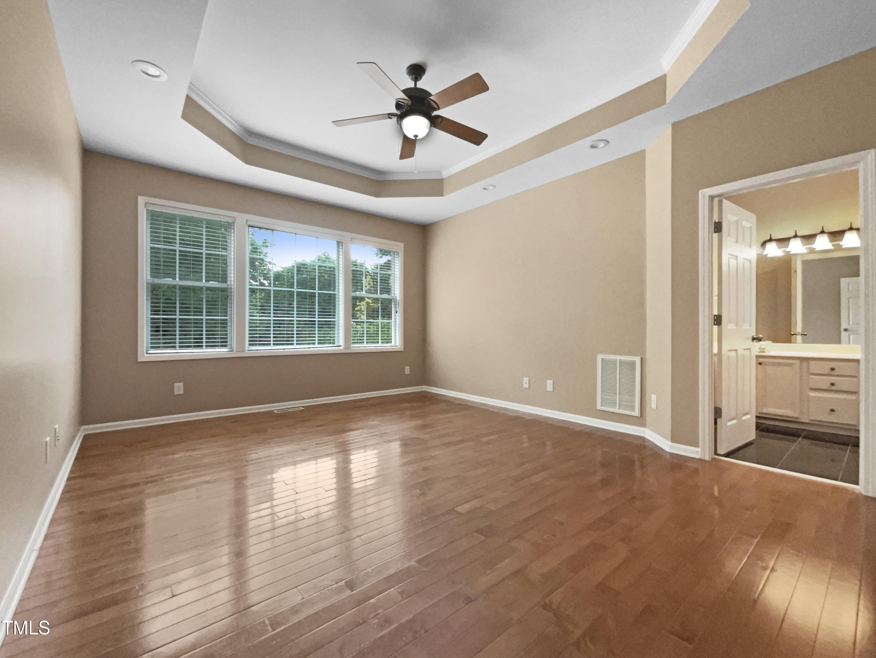 1005 Augustine Trail Cary, NC 27518 - Photo 12 of 19 a view of a livingroom with a ceiling fan and window