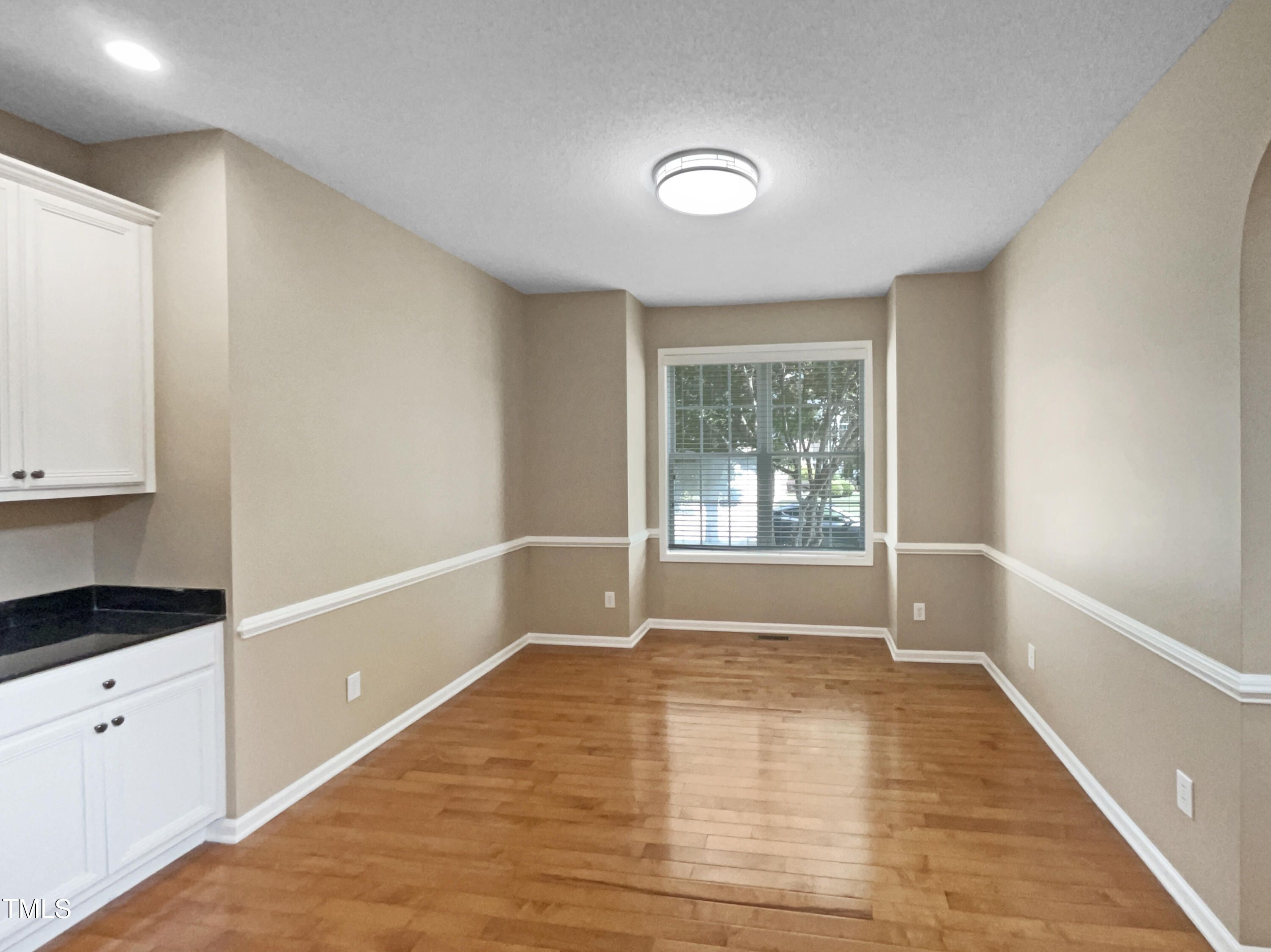 1005 Augustine Trail Cary, NC 27518 - Photo 13 of 19 a view of an empty room with a window