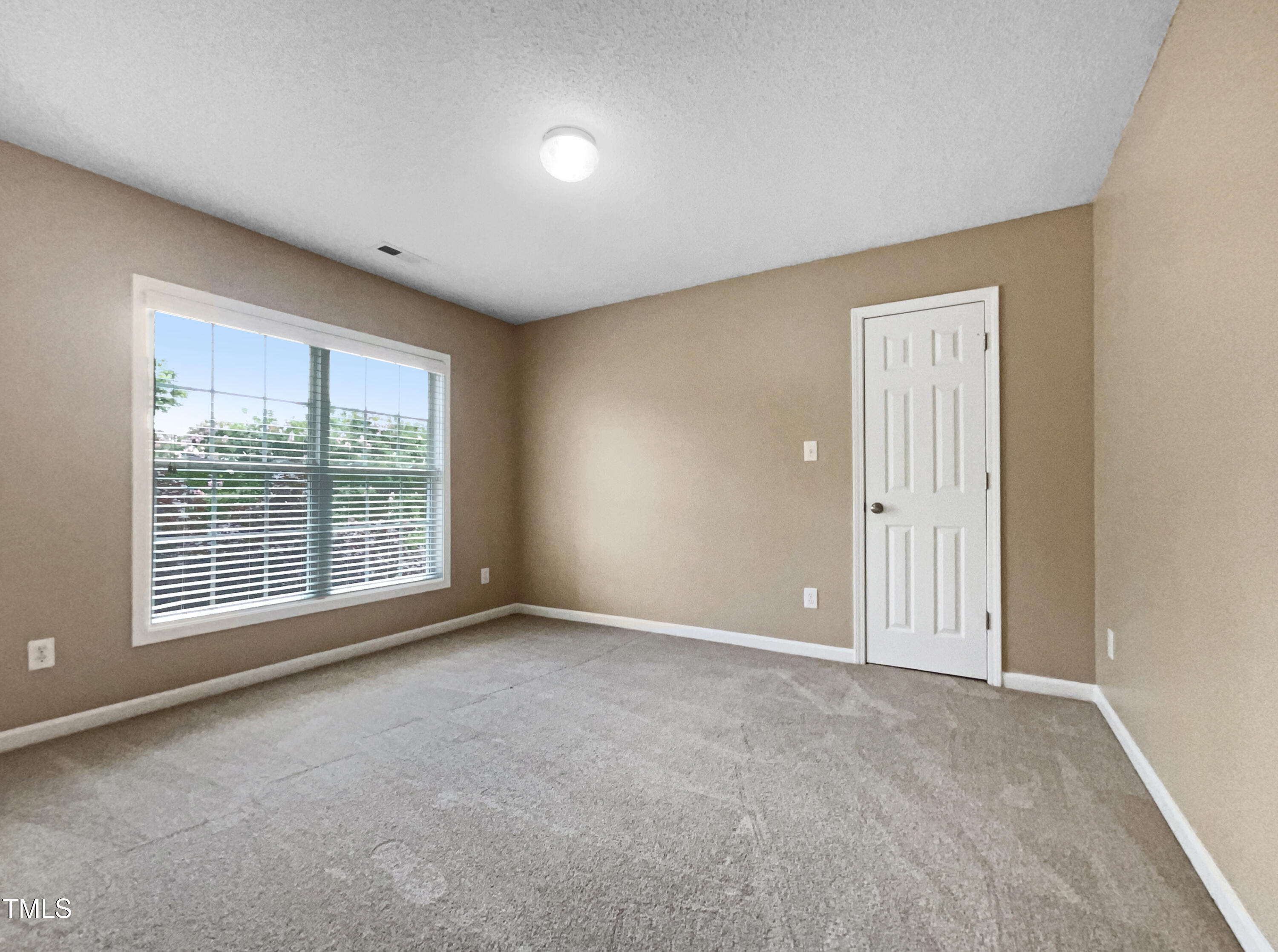 1005 Augustine Trail Cary, NC 27518 - Photo 16 of 19 a view of an empty room with a window