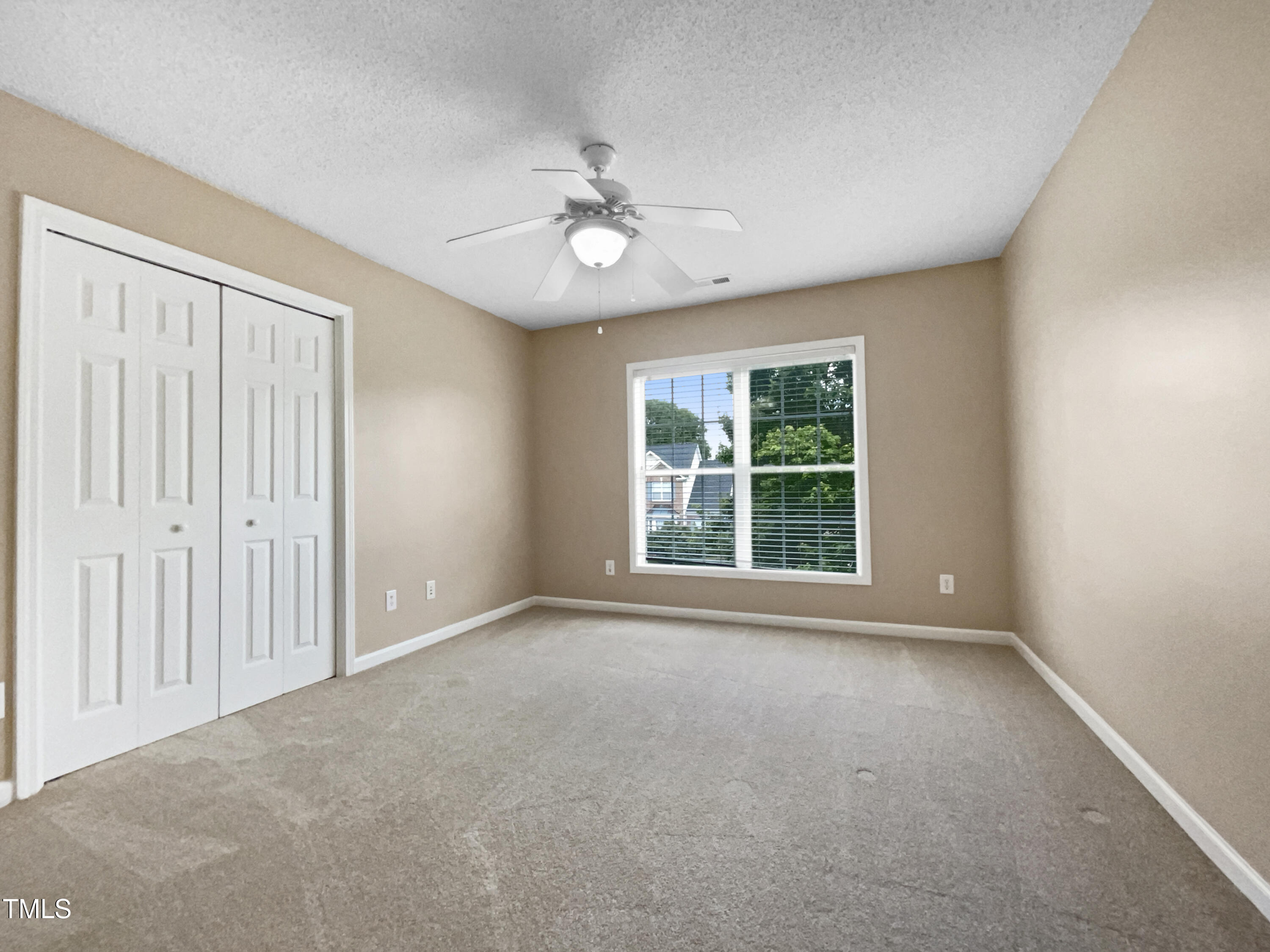1005 Augustine Trail Cary, NC 27518 - Photo 17 of 19 a view of an empty room with a window