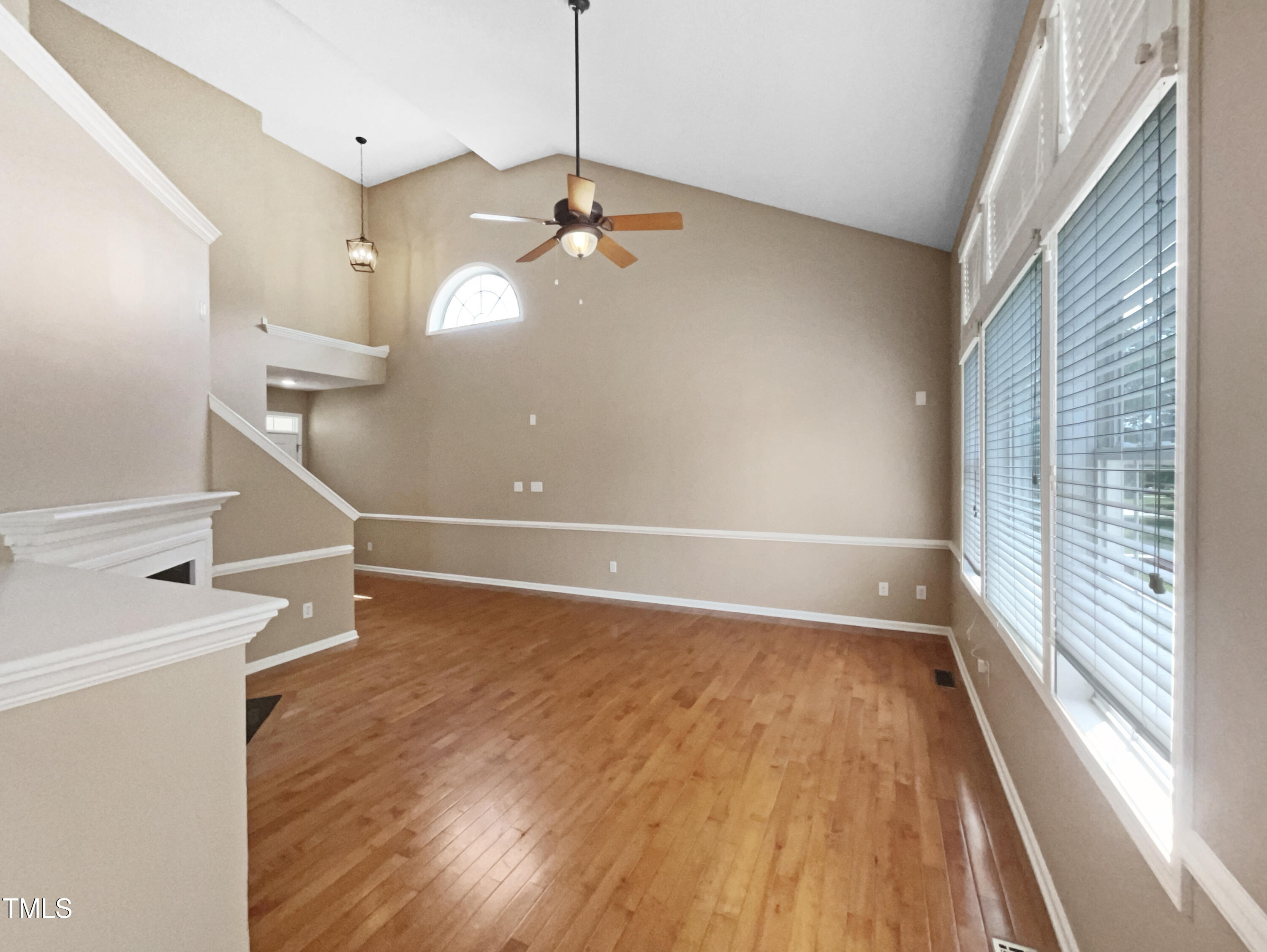 1005 Augustine Trail Cary, NC 27518 - Photo 3 of 19 a view of a room with wooden floor and a ceiling fan