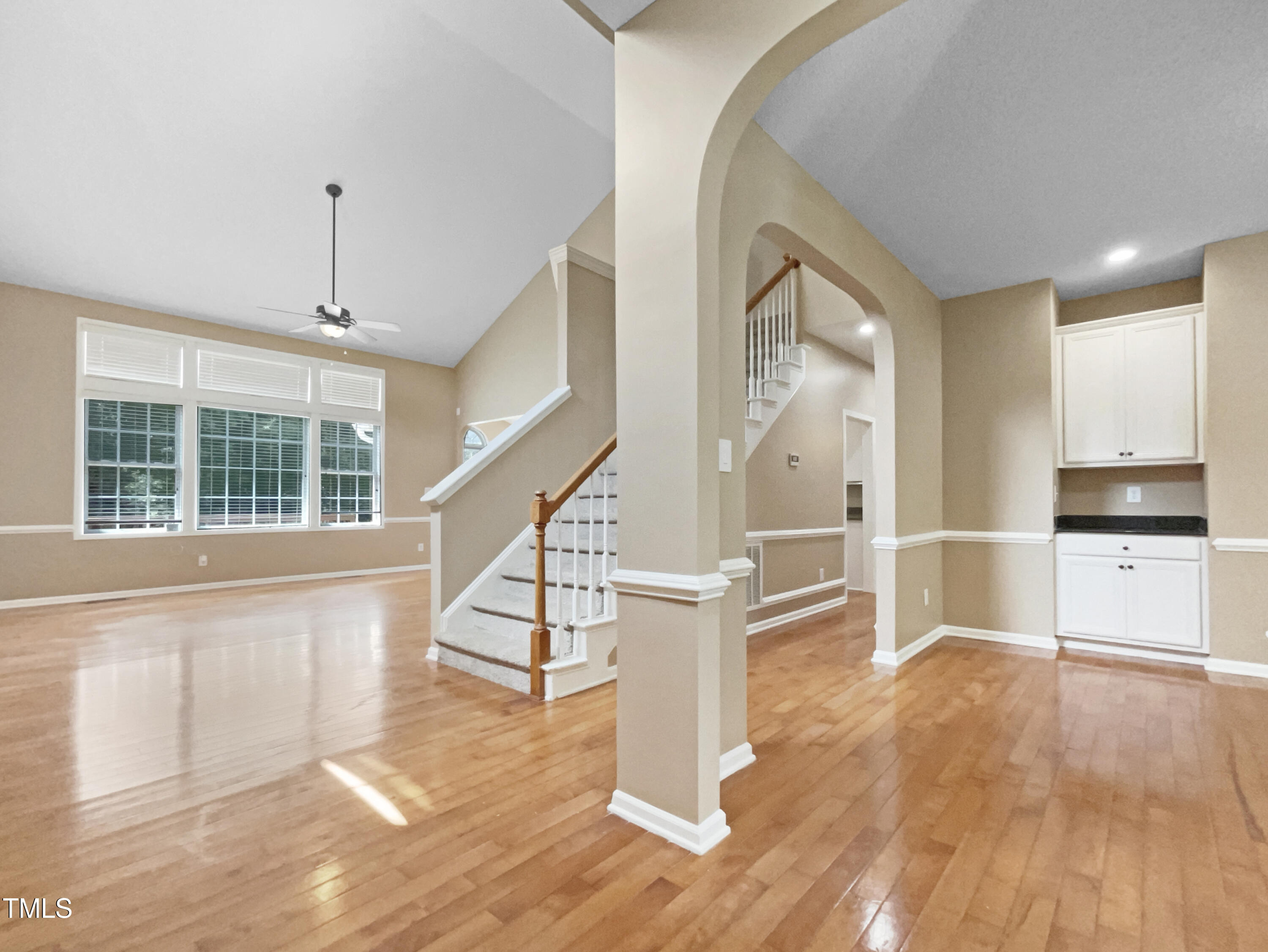 1005 Augustine Trail Cary, NC 27518 - Photo 9 of 19 a view of front door with hallway and wooden floor