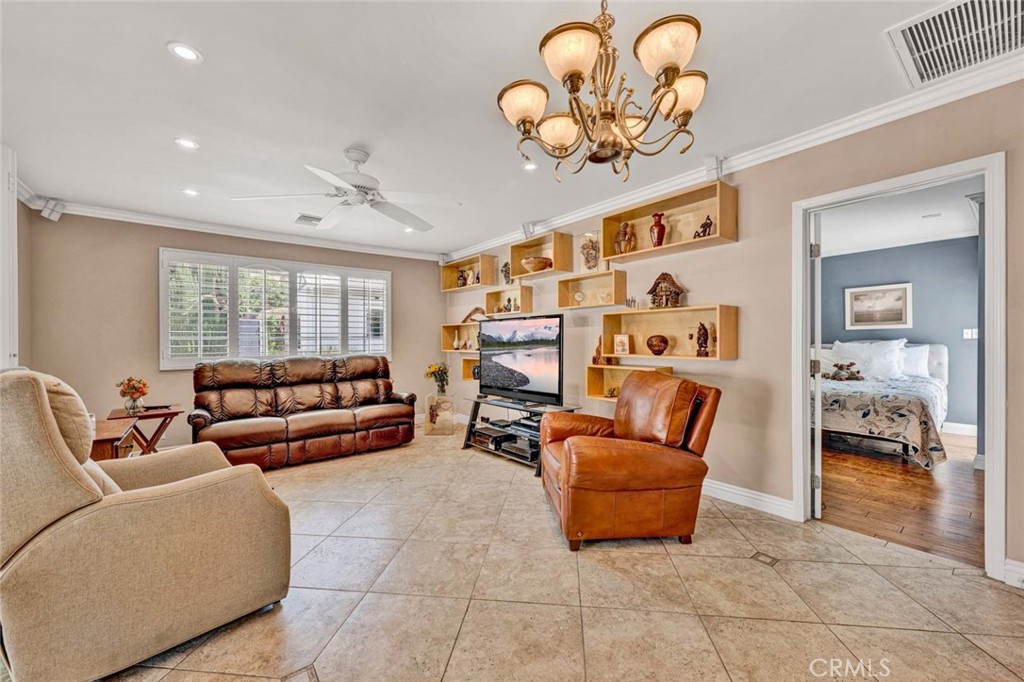5456 Cadbury Road Whittier, CA 90601 - Photo 33 of 67 a living room with furniture and a large mirror