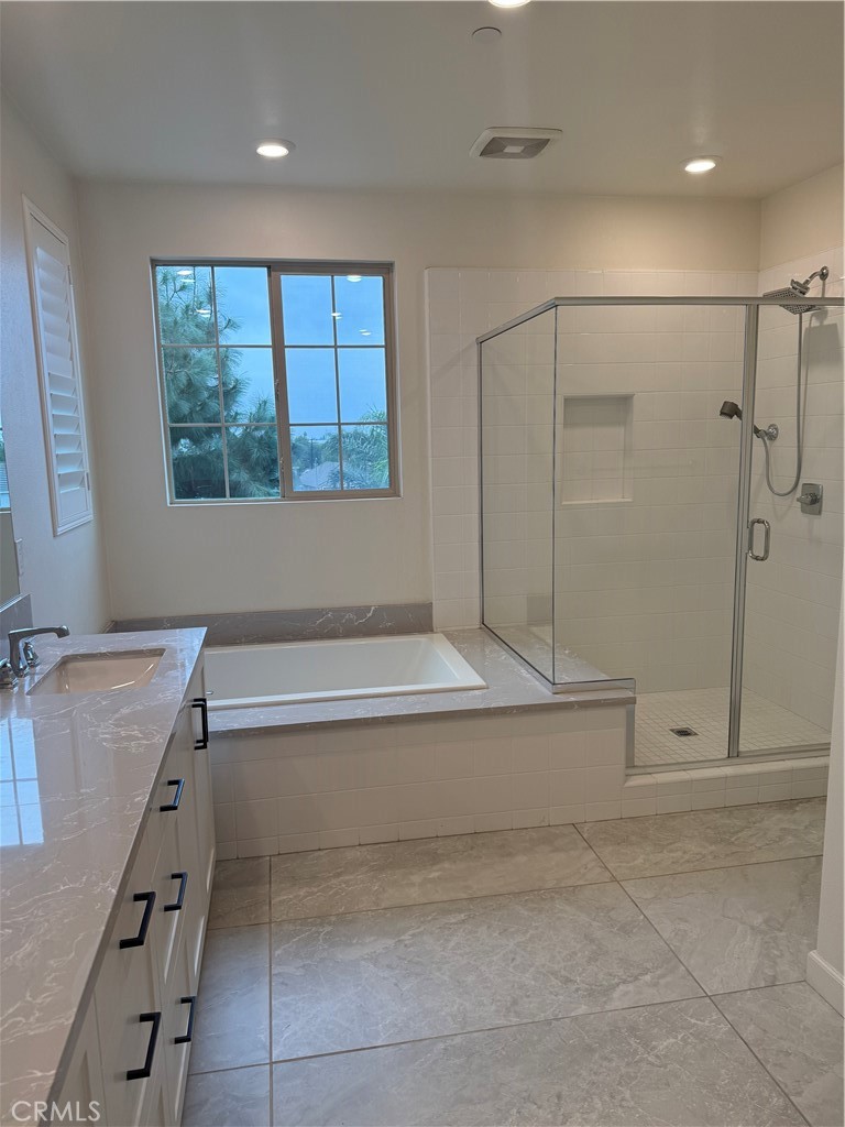 12358 Primrose Avenue Whittier, CA 90602 - Photo 15 of 50 a bathroom with a bathtub and a shower