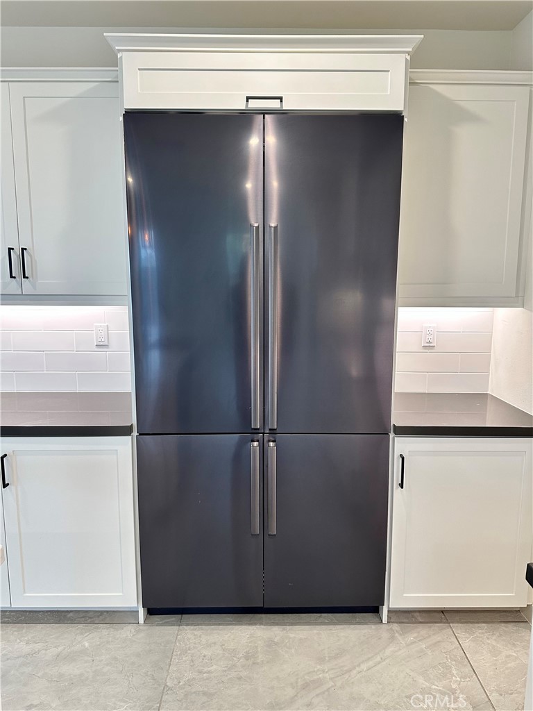 12358 Primrose Avenue Whittier, CA 90602 - Photo 21 of 50 a close view of water heater refrigerator