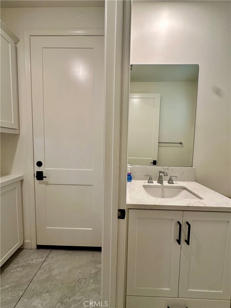 12358 Primrose Avenue Whittier, CA 90602 - Photo 26 of 50 a bathroom with a sink and a mirror
